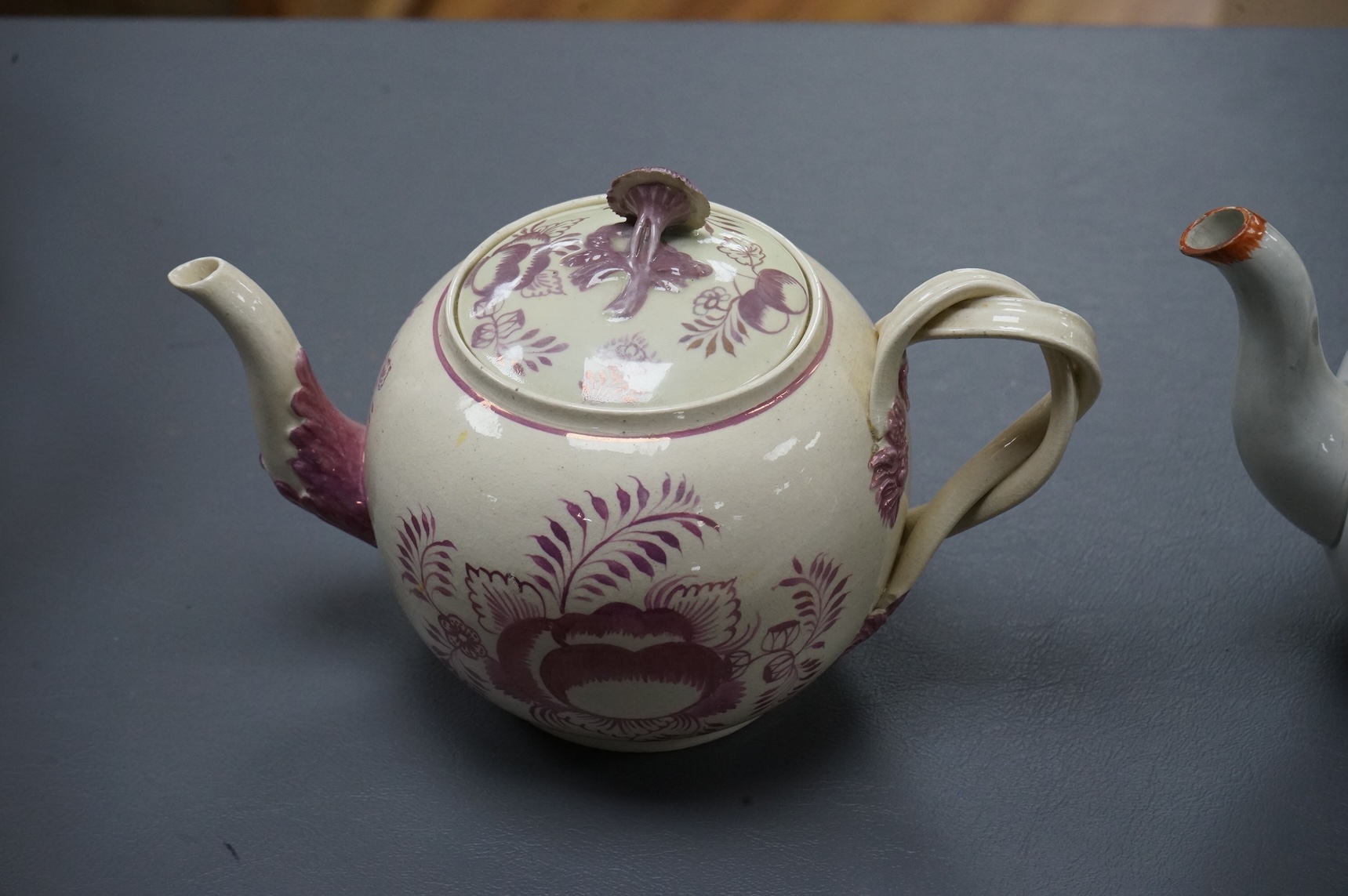 Leeds pottery, a creamware teapot, c.1785 and a pearlware teapot, c.1795, both stamped, tallest 13cm high